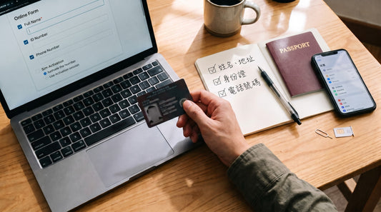 Cover image: top-down view of a desk with a laptop showing a web page, a passport, a handwritten notebook, a phone and a hand holding a card.